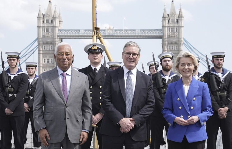 European Council President Antonio Costa, from left, Britain’s Prime Minister Keir Starmer and President of the European Commission Ursula von der Leyen with members of the Royal Navy on board Type 23 frigate HMS Sutherland in central London, following the UK-EU Summit, Monday, May 19, 2025. (Stefan Rousseau/Pool Photo via AP) LGK303 LGK303