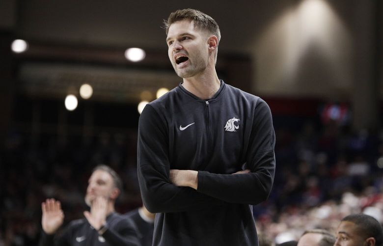 Washington State head coach David Riley directs his team during the first half of an NCAA college basketball game against Gonzaga, Saturday, Jan. 11, 2025, in Spokane, Wash. (AP Photo/Young Kwak)