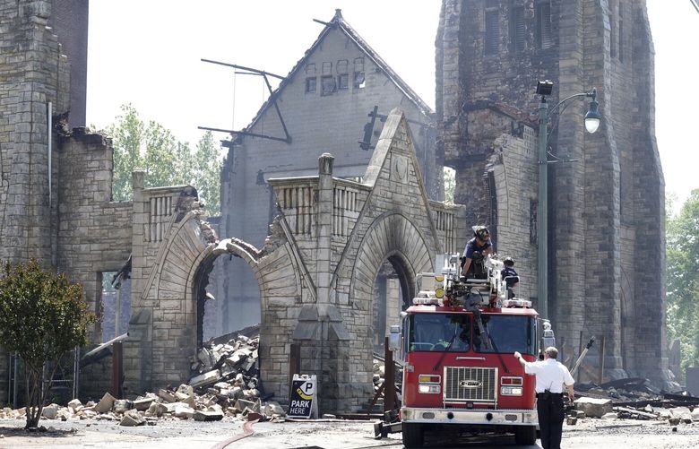 FILE – Firefighters gather outside the historic Clayborn Temple, a landmark from the civil rights movement with ties to Martin Luther King Jr., after it caught fire, April 28, 2025, in Memphis, Tenn. (AP Photo/Karen Pulfer Focht, File) RPAS103 RPAS103
