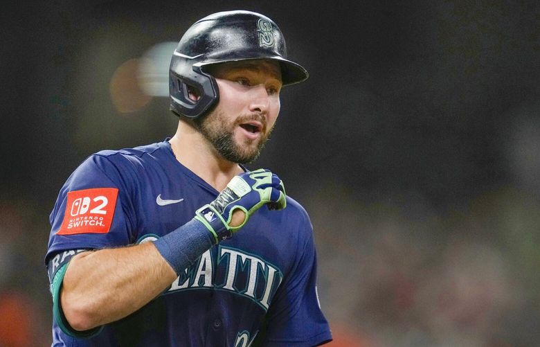 Seattle Mariners’ Cal Raleigh reacts after hitting a two-run home run during the seventh inning of a baseball game against the Houston Astros, Friday, May 23, 2025, in Houston. TXAL124