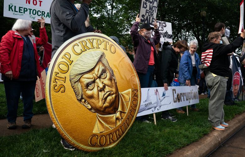 People protest as a guest arrives to a private dinner with President Donald Trump and buyers of his cryptocurrency tokens at Trump National Golf Club in Sterling, Va., on Thursday, May 22, 2025. (Elizabeth Frantz/The New York Times) XNYT0104 XNYT0104