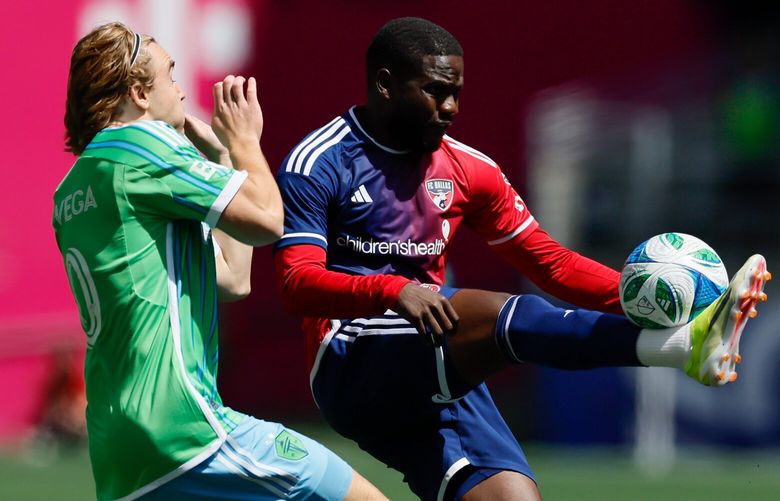 FC Dallas defender Geovane Jesus clears a ball past Seattle Sounders FC forward Pedro De La Vega during the first half Saturday, May 24, 2025 in Seattle. 230153