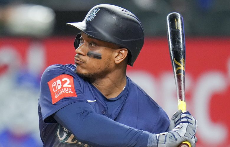 Seattle Mariners’ Jorge Polanco waits for a pitch from the Texas Rangers during the fifth inning of a baseball game Friday, May 2, 2025, in Arlington, Texas. (AP Photo/Julio Cortez)
