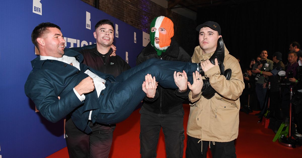 Member of Irish rap trio Kneecap charged with a terror offense in the UK