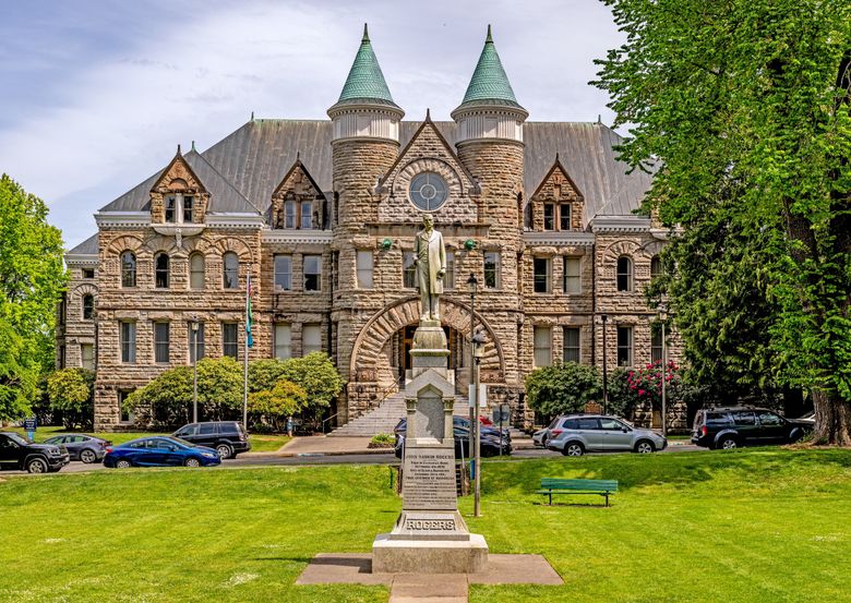 NOW: The former courthouse, familiarly called “Old Cap,” overlooks Sylvester Park in downtown Olympia. In the foreground stands a statue of our state’s third governor, John R. Rogers, who arranged for the building’s purchase in 1901 for use as the state Capitol. (Jean Sherrard)