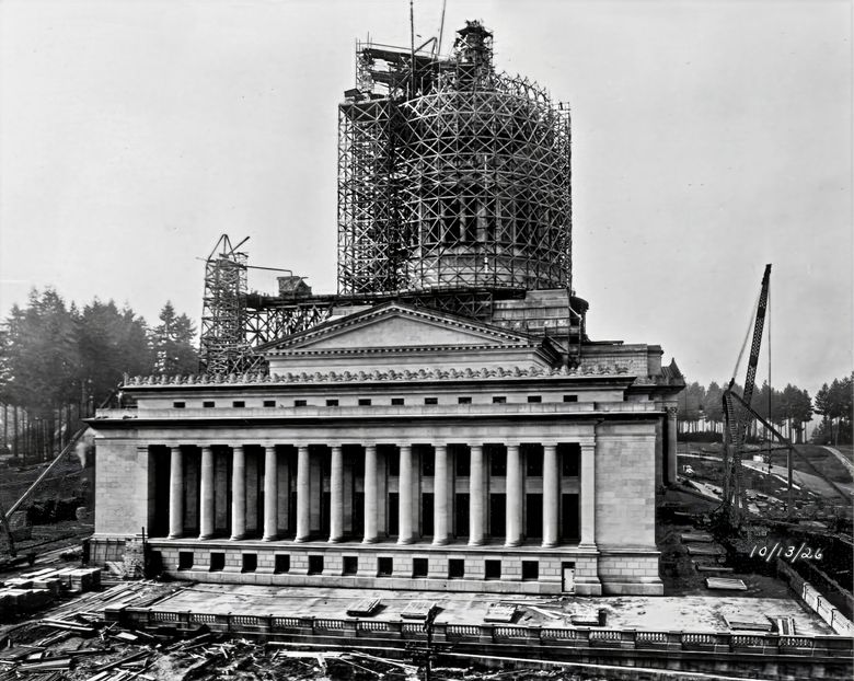 THEN: On Oct. 13, 1926, midway through construction of the Doric-colonnaded Capitol Building, its masonry dome peeks through scaffolding. The Olympia dome is one foot shorter than the iron dome atop the U.S. Capitol Building in Washington, D.C. (Paul Dorpat Collection)