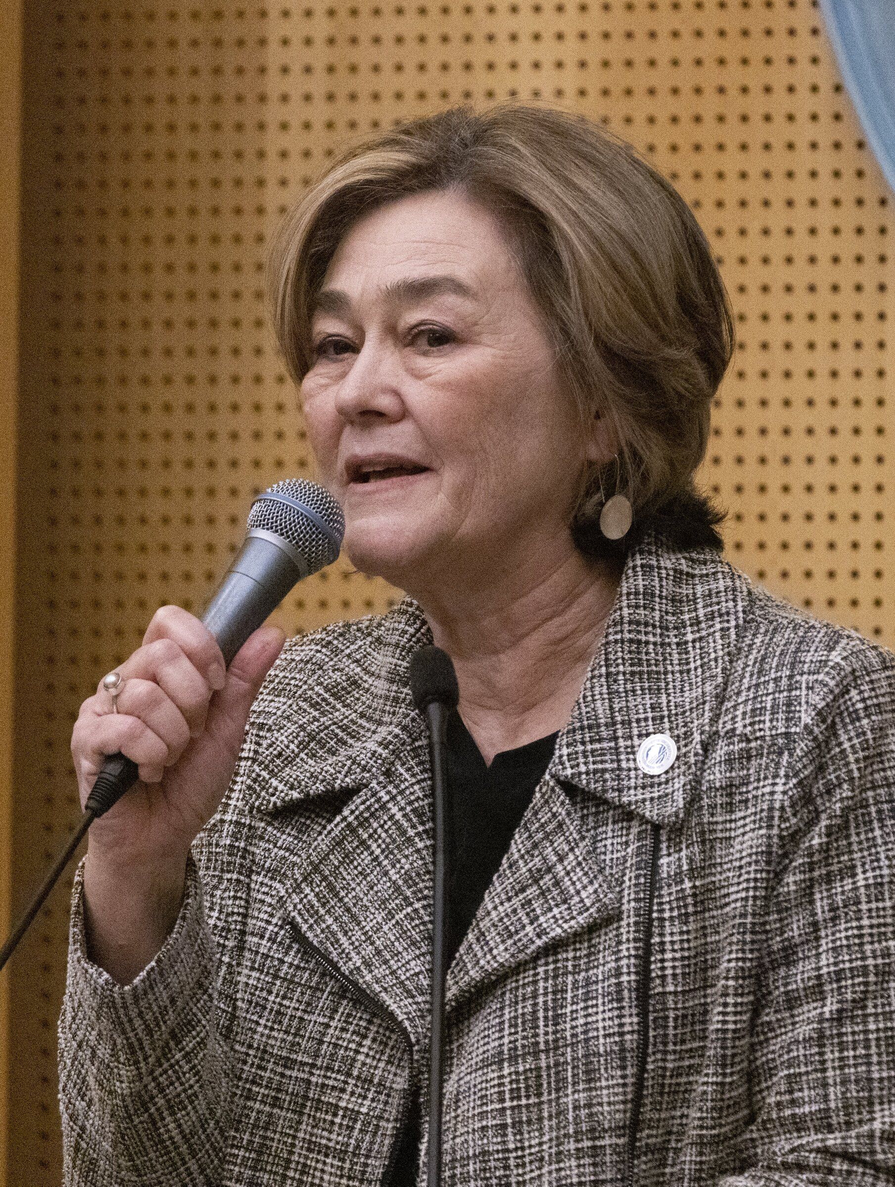 Cathy Moore, who represents Council District No. 5, speaks after being sworn in as a new Seattle City Council member Jan. 2, 2024. Moore will step down this summer. (Ellen M. Banner / The Seattle Times)
