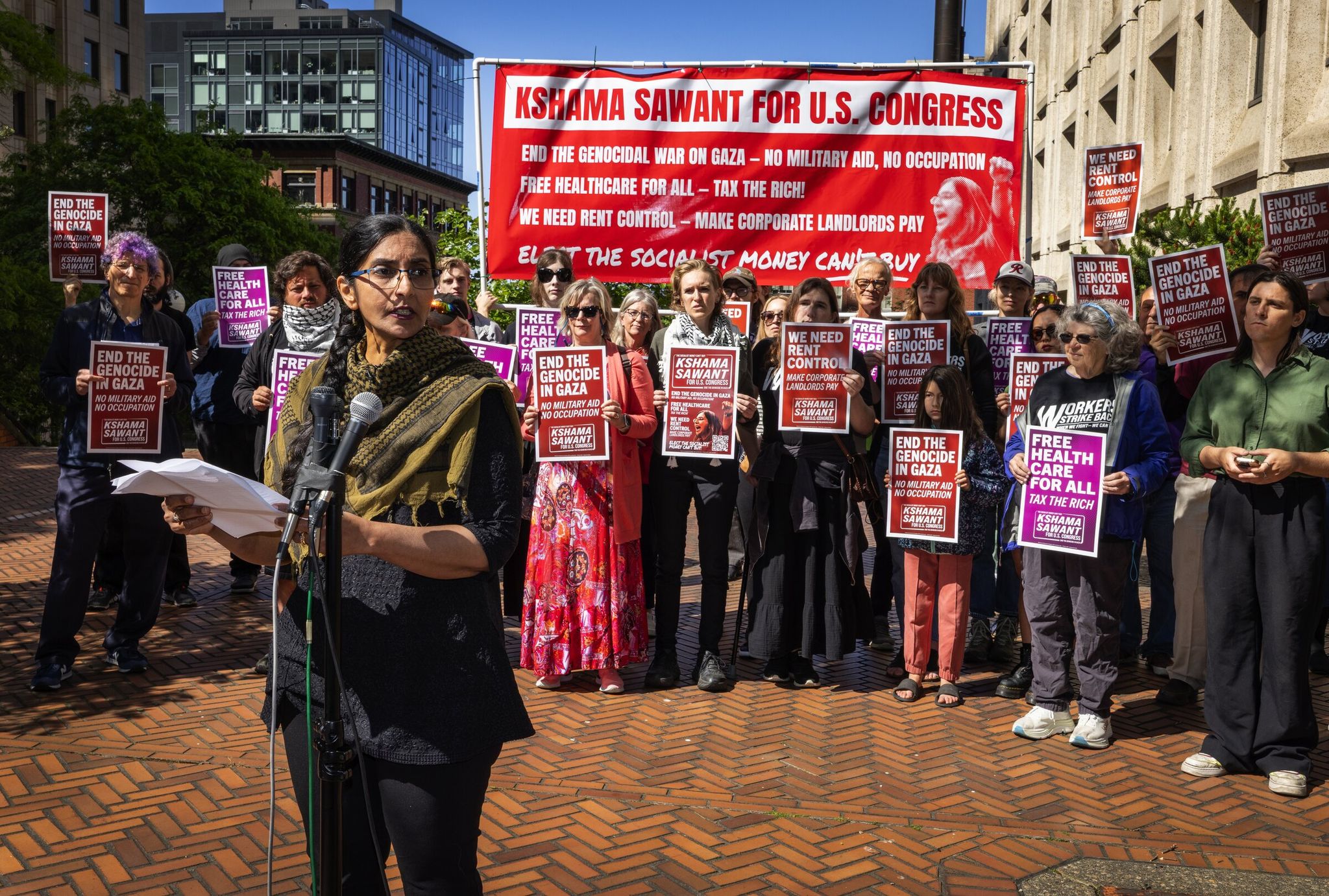 Running as a socialist, Kshama Sawant announces her campaign for Congress, challenging Rep. Adam Smith, D-Bellevue, outside the Jackson Federal Building in Seattle. (Ken Lambert / The Seattle Times)