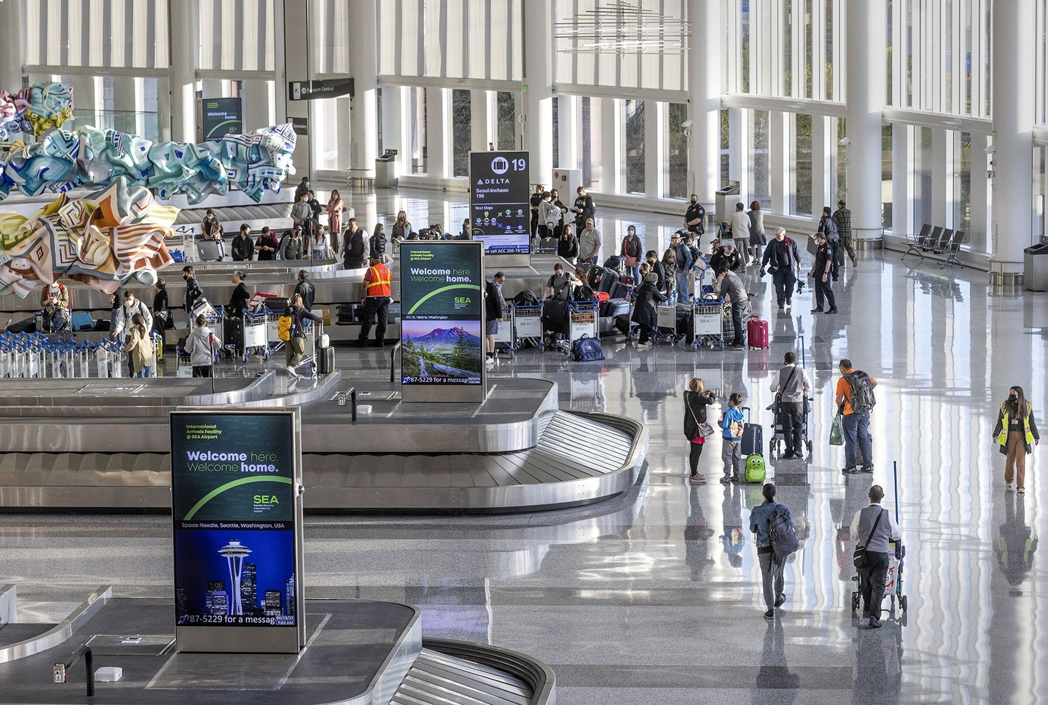 Passengers arrive at the International Arrivals Facility at Seattle-Tacoma International Airport. Under an executive order issued by President Donald Trump on Wednesday, residents of 19 countries will be banned or partially banned from entering the U.S., effective Monday. (Ellen M. Banner / The Seattle TImes 2022)
