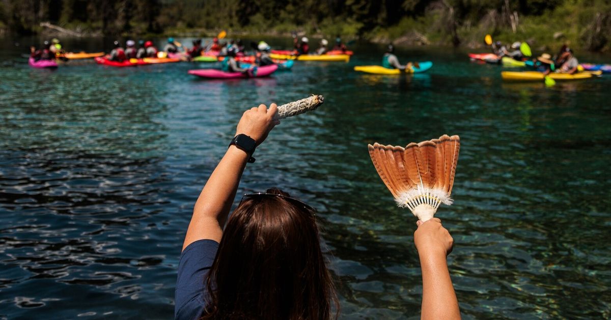 Young kayakers begin a journey down a river set free for the first time in ...