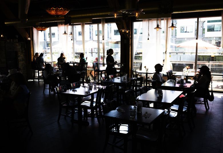 Pub 70 offers a nice break from the sun and crowds at quieter, northerly Pier 70, along the downtown waterfront. (Ken Lambert / The Seattle Times)