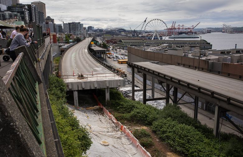 Work proceeds on the demolition of the Alaskan Way Viaduct, looking south from Victor Steinbrueck Park. (Ellen M. Banner / The Seattle Times, 2019)