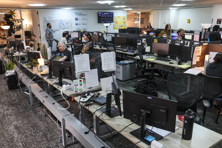 The call center of Crisis Connections in Seattle. Crisis Connections has run the local suicide lifeline for decades, but it’s only been dispatching mobile crisis teams throughout the county since December. (Kevin Clark / The Seattle Times)