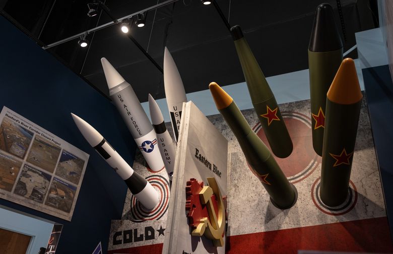 Artistic renderings of missiles jut out of a wall at the REACH Museum. (Nick Wagner / The Seattle Times)