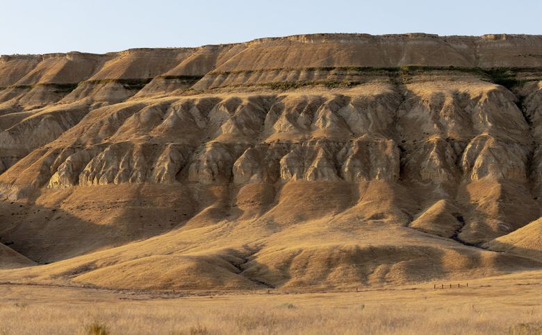The evening light hits a portion of the Ringold Formation, part of Hanford Reach National Monument&#8217;s White Bluffs. The national monument was established in 2000, protecting one of Washington&#8217;s most unique natural areas. (Nick Wagner / The Seattle Times)
