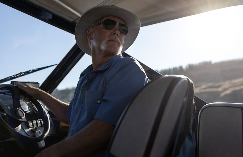 Todd Steele navigates the Columbia River within the Hanford Reach National Monument on July 9. Guarding this free-flowing stretch of the Columbia is a family business for the Steeles. The Richland-based riverkeeper is stepping out of his father&#8217;s shadow as he attempts to secure continued support for the national monument, established in Central Washington 25 years ago.  (Nick Wagner / The Seattle Times)