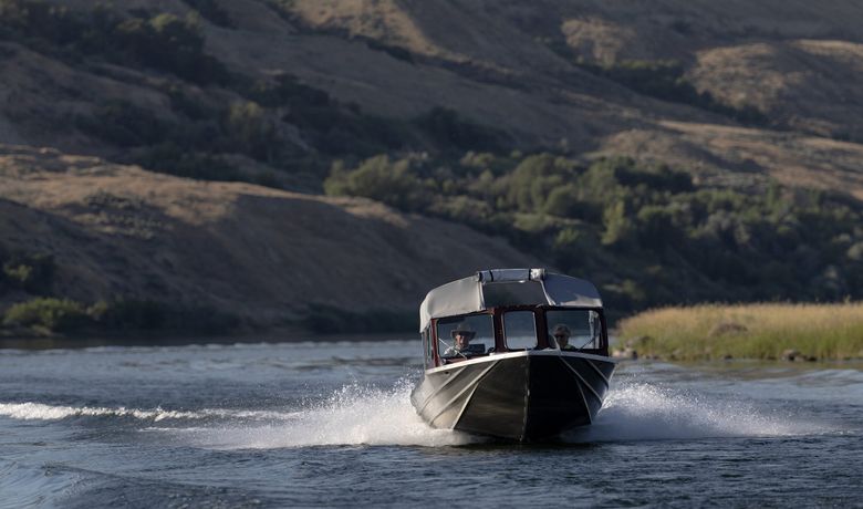 Mike and Karyn Wiemers boat on the Columbia River within the Hanford Reach National Monument on July 9. (Nick Wagner / The Seattle Times)