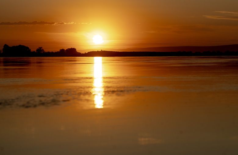 The sun sets over the Columbia River within the Hanford Reach National Monument on July 8. (Nick Wagner / The Seattle Times)