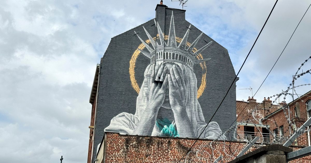 A new mural in France shows the Statue of Liberty covering her eyes in a swipe at Trump