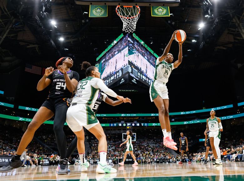 Dominique Malonga pulls down the rebound in the first half last month. (Dean Rutz / The Seattle Times)