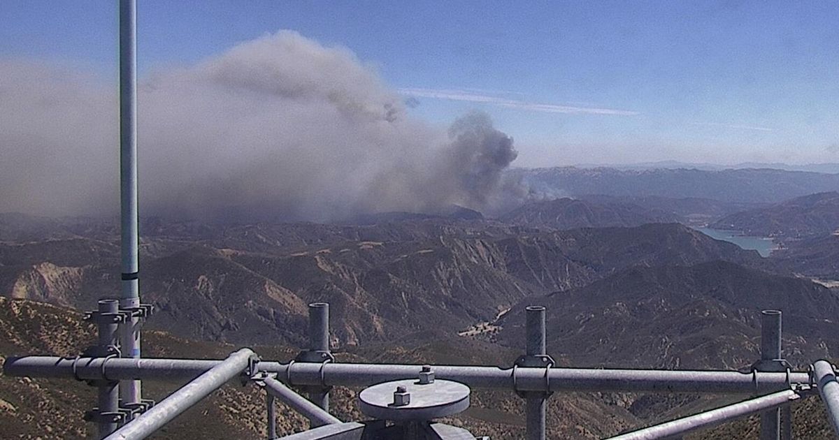Rapidly spreading brush fire prompts an evacuation order for thousands ...