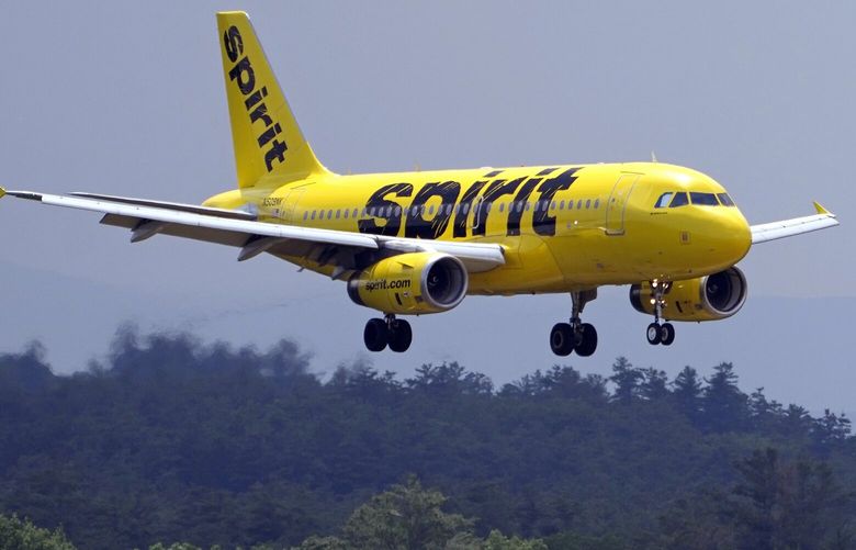 FILE – A Spirit Airlines 319 Airbus approaches Manchester Boston Regional Airport for a landing, Friday, June 2, 2023, in Manchester, N.H. (AP Photo/Charles Krupa, File) NYBZ216 NYBZ216