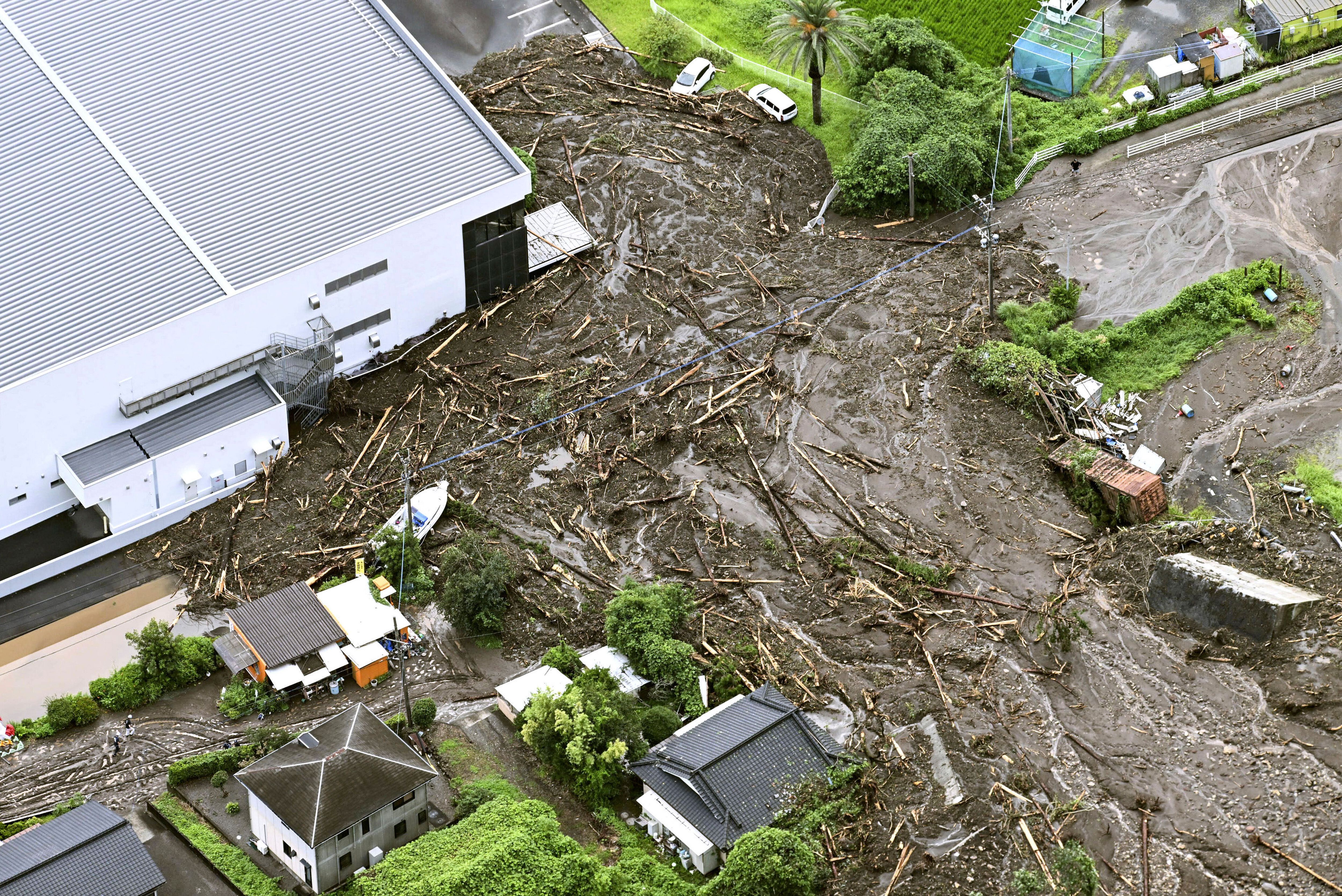 Heavy rain slams southern Japan, triggering floods and mudslides