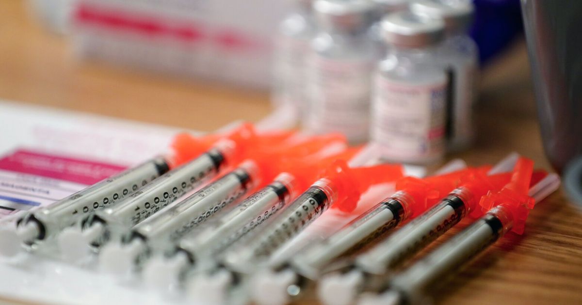 Person receiving COVID-19 vaccine
