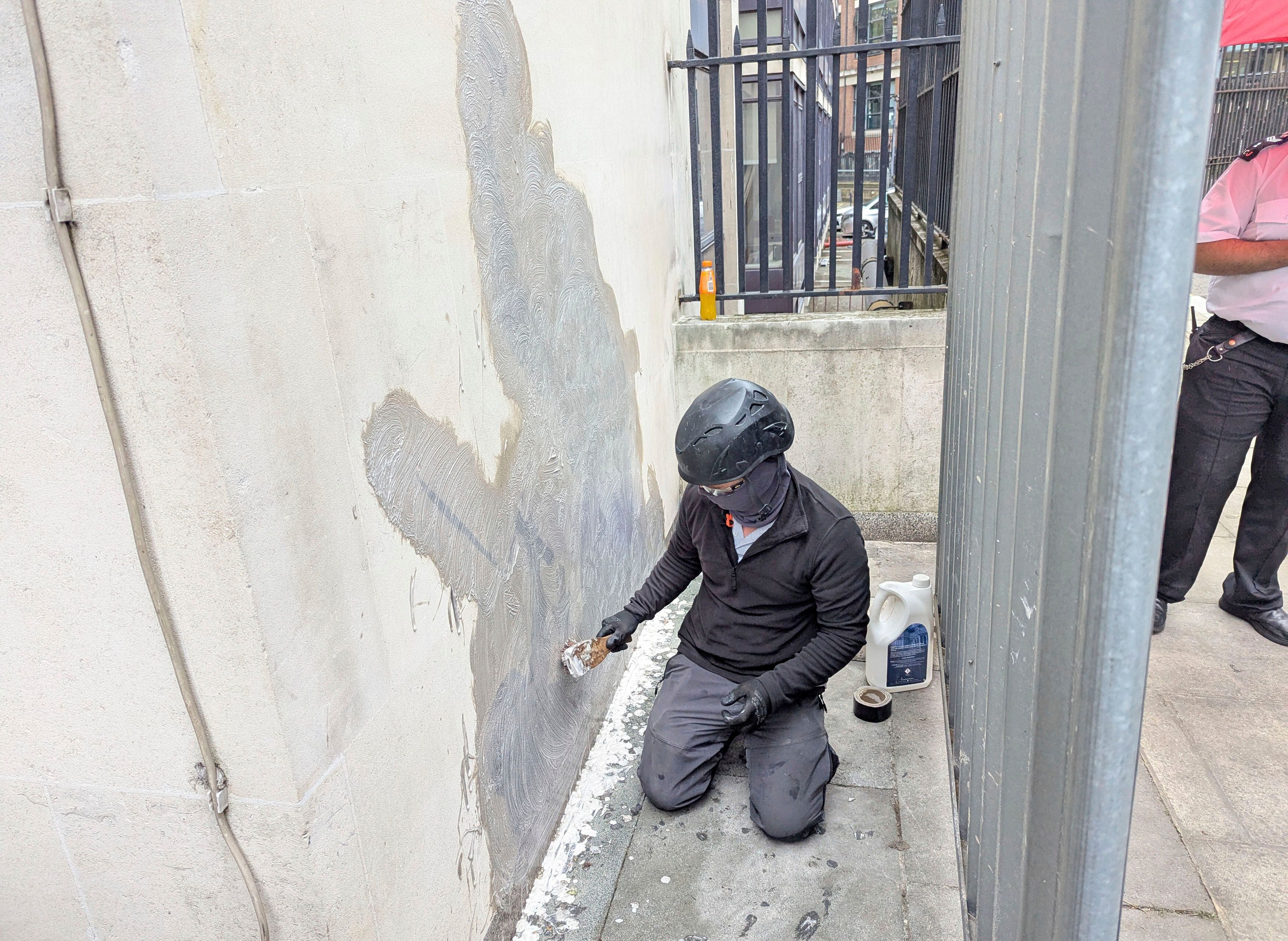 Banksy mural of a judge beating a protester is scrubbed from