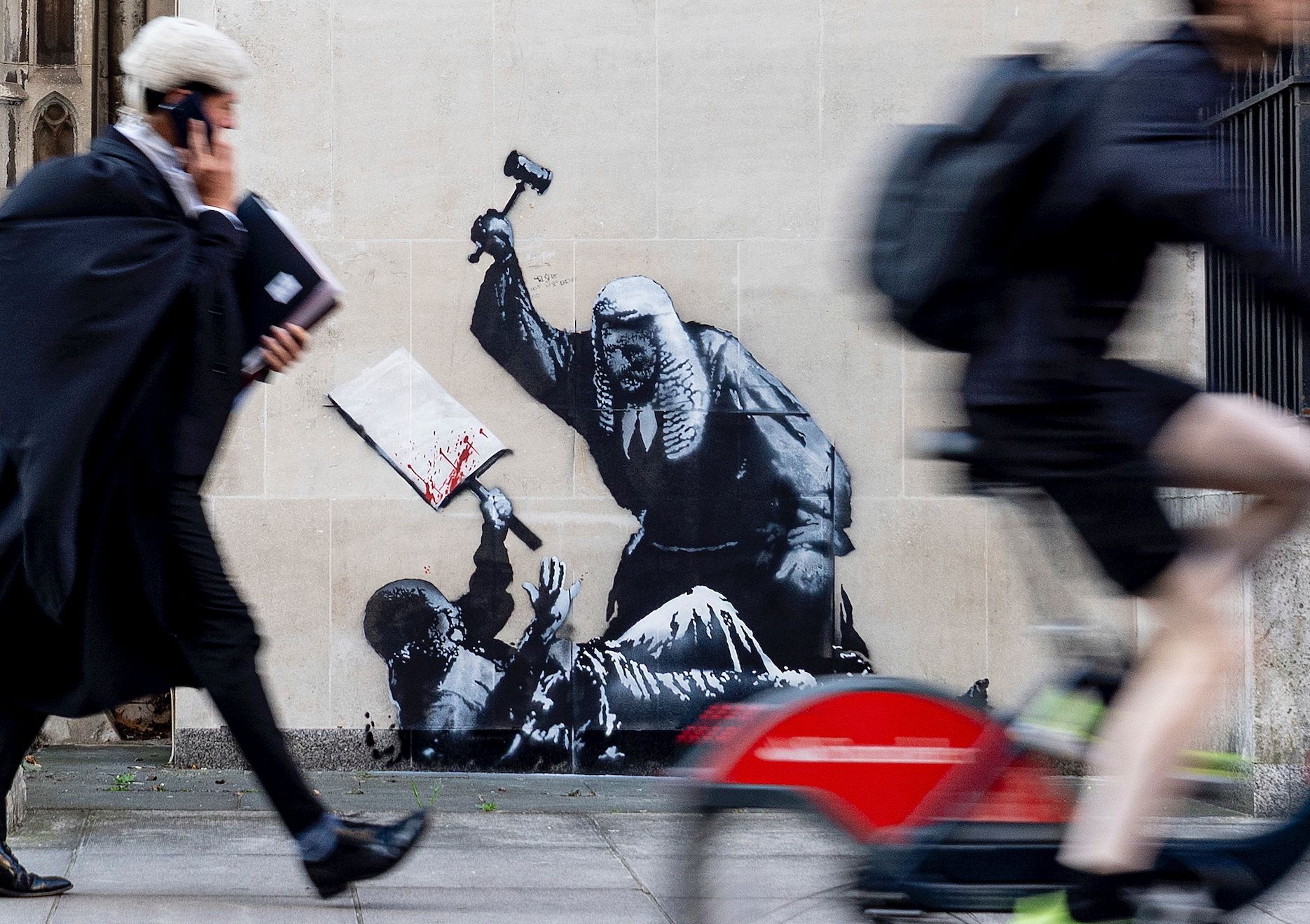 Banksy mural of a judge beating a protester is scrubbed from