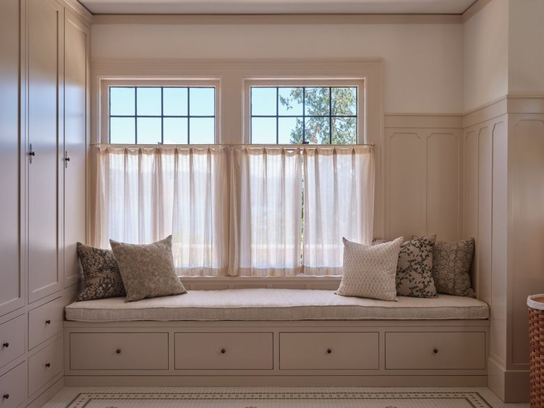 Srilakshmi Remala and Viren Kamdar turned two upstairs bedrooms into a primary suite without moving any windows. A bank of built in closets lets the primary bathroom double as a dressing room. (Michael Clifford)