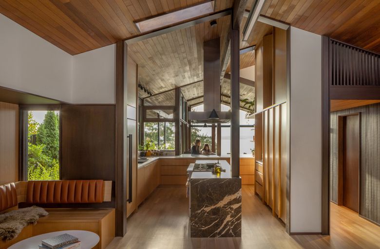 Removing a wall meant more water views from the kitchen and living room of this midcentury modern home in West Seattle. (Rafael Soldi)
