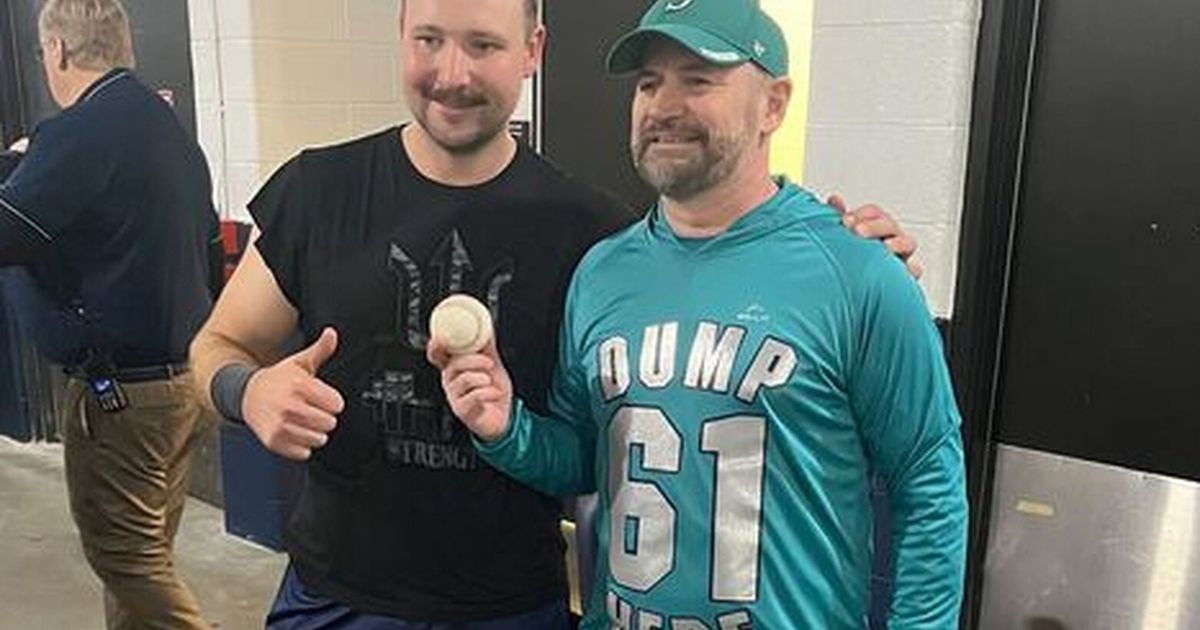 ‘Dump Here’ fan who caught Cal Raleigh’s HR ball ‘in shock’ over lucky grab