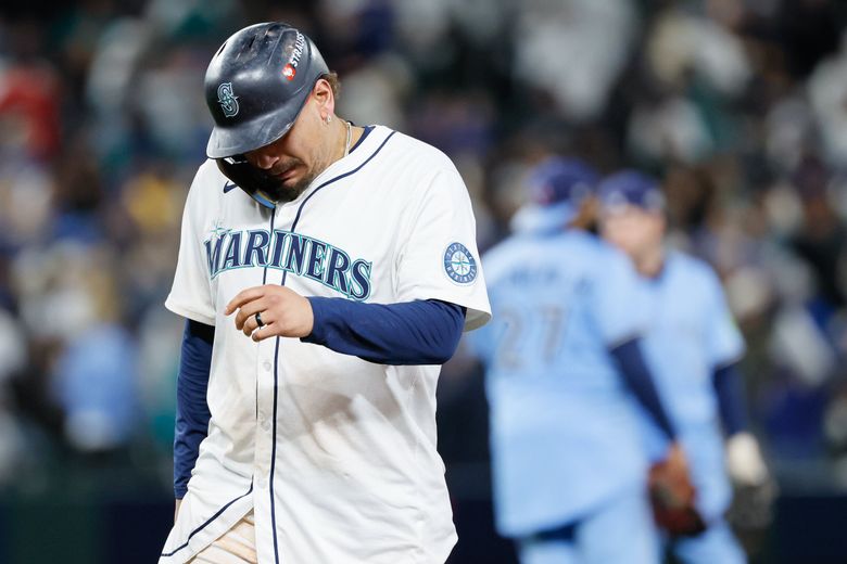 Seattle Mariners first baseman Josh Naylor walks off the field after a 8-2 loss to the Toronto Blue Jays Thursday in Seattle. (Jennifer Buchanan / The Seattle Times)