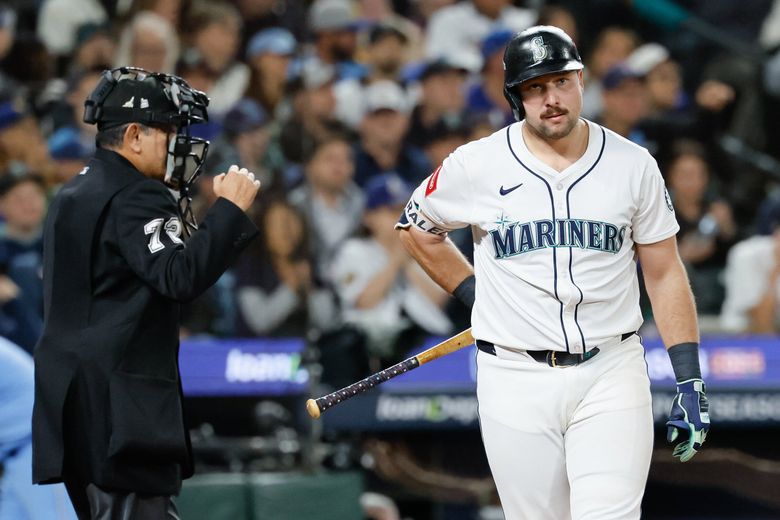 Seattle Mariners catcher Cal Raleigh strikes out swinging during the third inning Thursday in Seattle. (Jennifer Buchanan / The Seattle Times)