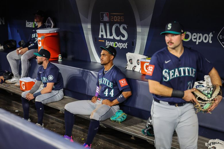 Cal Raleigh and Julio Rodriguez watch at Toronto celebrates their World Series berth following a 4-3 win in Game 7 of the ALCS.  The Seattle Mariners played the Toronto Blue Jays in the deciding Game 7 of the ALCS Monday, October. 20, 2025 at Rogers Centre, in Toronto, Canada. (Dean Rutz / The Seattle Times)
