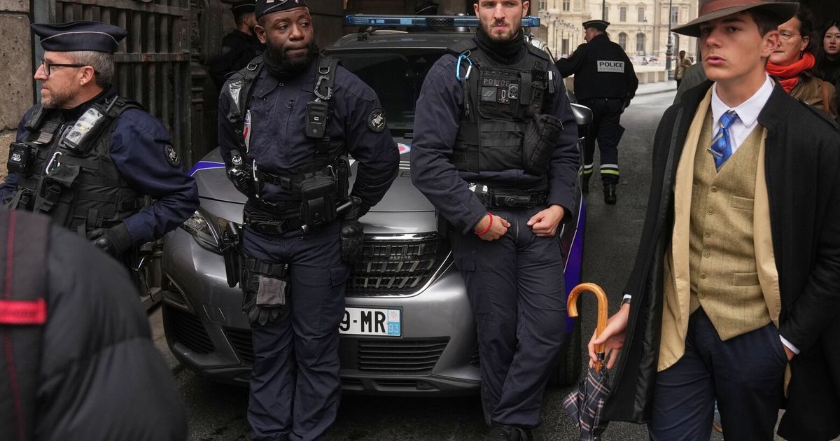 Inspector Clouseau? The mystery man in an AP photo after the Louvre jewel heist creates a buzz