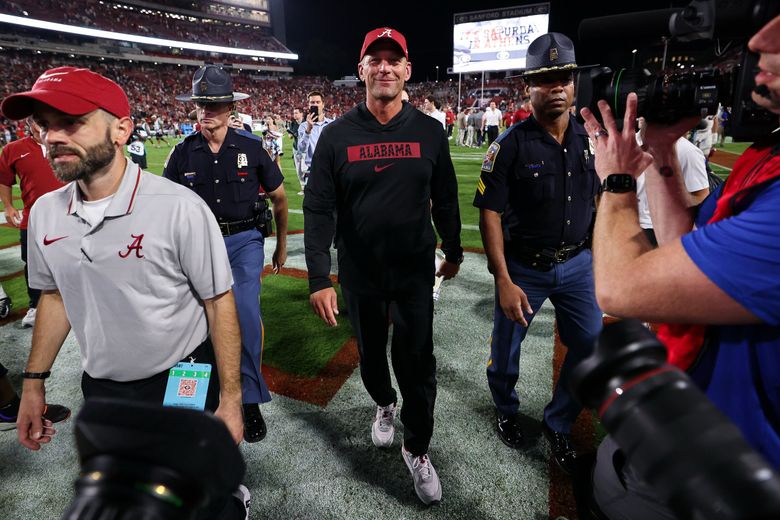 Alabama head coach Kalen DeBoer, center, walks off of the field after a game against Georgia on Sept. 27, 2025, in Athens, Ga. (Colin Hubbard / AP)