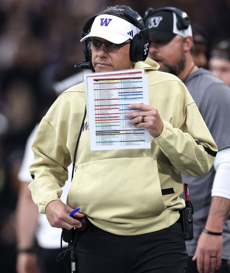 Washington coach Jedd Fisch walks the sideline during a  game against Rutgers last month. (Nick Wagner / The Seattle Times)