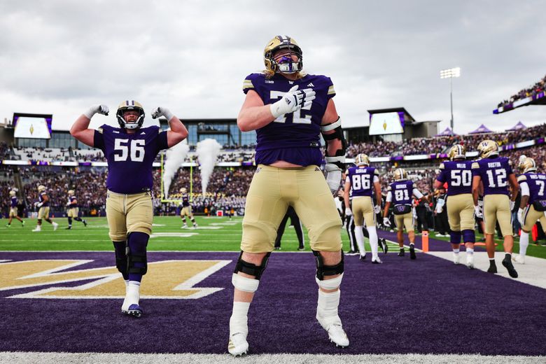 Washington offensive linemen John Mills celebrates a touchdown against Illinois, Oct. 25, 2025 in Seattle. (Dean Rutz / The Seattle Times)