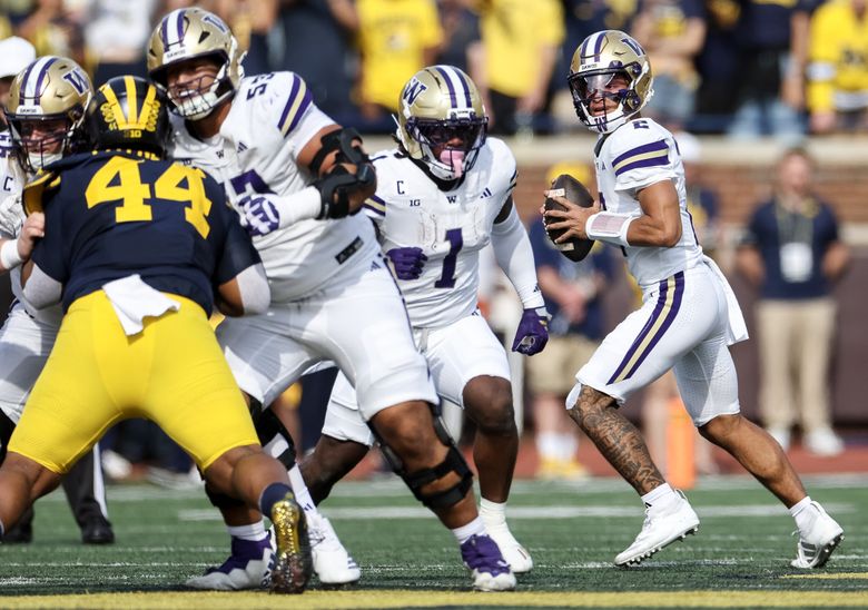 Washington quarterback Demond Williams Jr. (2) looks for an open receiver against Michigan during a game last month. (Nick Wagner / The Seattle Times)