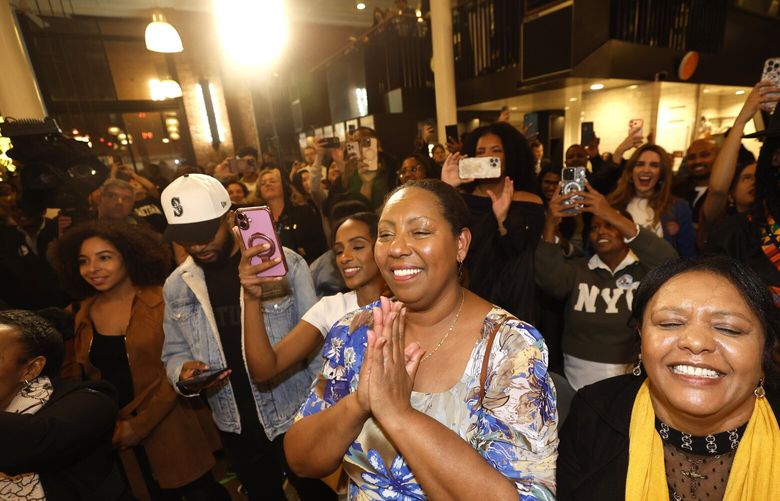 Supporters cheer including Wobenesh Ayele childhood friend, center, and his Mom Abeba Anagaw, right, as Girmay takes the stage after early results are announced King County Council Chair Girmay Zahilay greets supporters at Darkalino’s restaurant on election night in his race for King County Executive in Seattle on Tuesday, November 4, 2025.