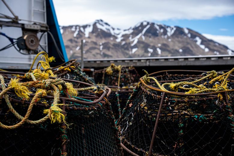 Cod pots are stacked aboard the fishing boat Victory in late May in Unalaska, Alaska. Captain Bill Wahl said orcas have learned to rip open the pots to get to the fish inside. (Loren Holmes / Anchorage Daily News)