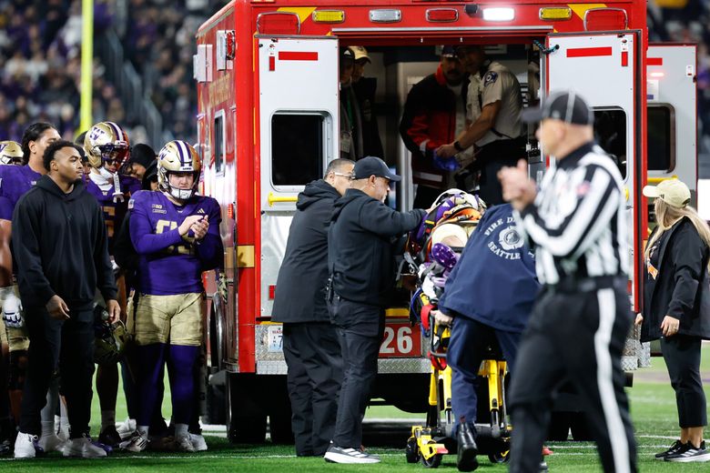 Washington Raiden Vines-Bright is transported by ambulance off the field. The Purdue Boilermakers played the Washington Huskies in Big-Ten Football Saturday at Husky Stadium, in Seattle. (Dean Rutz / The Seattle Times)