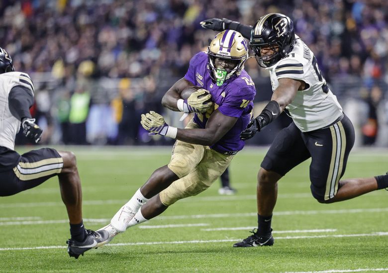 Adam Mohammed cuts upfield and gets the ball to the two yard line setting up a Washington score in the second quarter. Mohammed had 59-yards rushing on 17 carries, and three touchdowns against Purdue. The Purdue Boilermakers played the Washington Huskies in Big-Ten Football Saturday at Husky Stadium, in Seattle. (Dean Rutz / The Seattle Times)