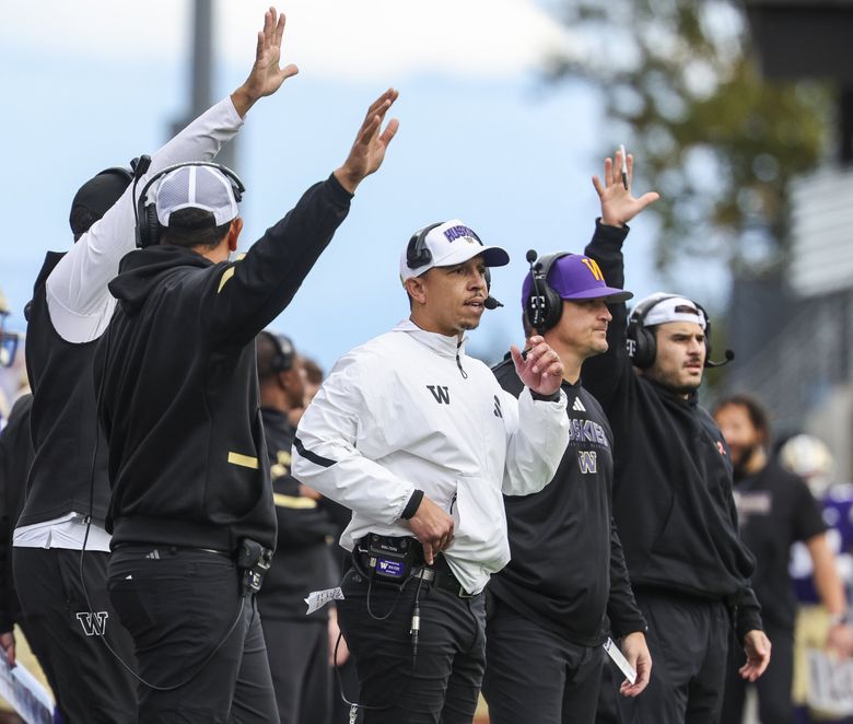 Washington defensive coordinator Ryan Walters, center, and his staff watch as the Huskies try to put a red zone stop on Illinois in the fourth quarter, Oct. 25, 2025 at Husky Stadium in Seattle. (Dean Rutz / The Seattle Times)