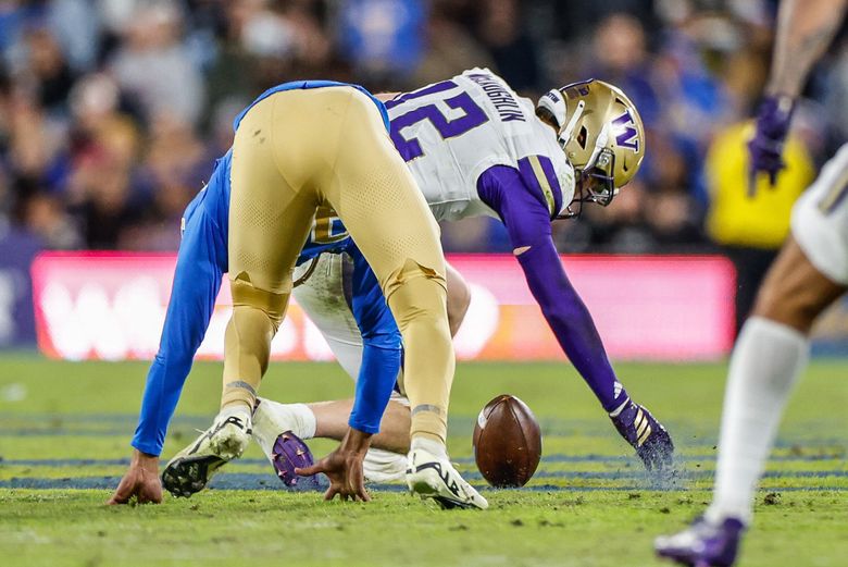 Washington’s Alex McLaughlin scoops up the UCLA fumble and returns it 59-yards for a touchdown in the second quarter. The University of Washington Huskies played UCLA in Big-Ten football Saturday, Nov. 22, 2025 at the Rose Bowl, in Pasadena, CA. (Dean Rutz / The Seattle Times)