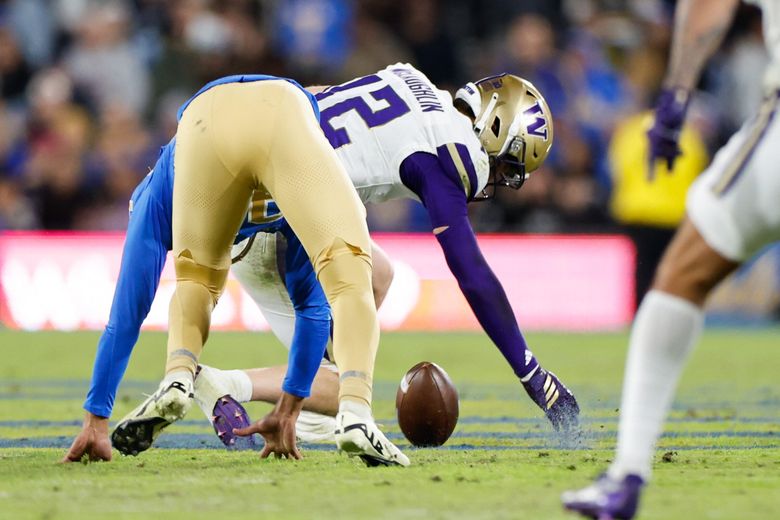 UCLA blows a chance at a field goal, and Washington Huskies safety Alex McLaughlin (12) returns it for a touchdown. The University of Washington Huskies played UCLA in Big-Ten football Saturday, Nov. 22, 2025 at the Rose Bowl, in Pasadena. (Dean Rutz / The Seattle Times)