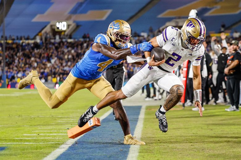 Washington’s Demond Williams Jr. gets inside the pylon to score on the 25-yards run in the second quarter, pupshed out of bounds by UCLA defesnive back Key Lawrence. The University of Washington Huskies played UCLA in Big-Ten football Saturday, Nov. 22, 2025 at the Rose Bowl, in Pasadena, CA. (Dean Rutz / The Seattle Times)