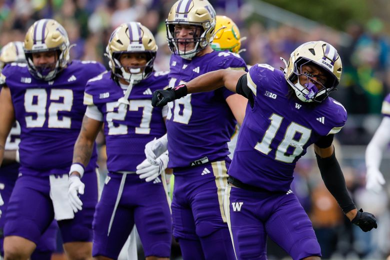 Washington Huskies safety Rylon Dillard-Allen celebrates a run stop during the second quarter of the Huskies’ loss to Oregon at Husky Stadium on Saturday. (Jennifer Buchanan / The Seattle Times)